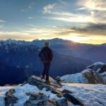 man hiking in snowy mountains at sunset online porn recovery program how much porn is an addiction